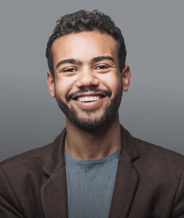 A relaxed patient smiling in the dental chair